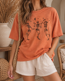 Moonlight Dancing Skeletons Graphic Tee