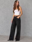Studded Denim Fashion Portrait.png