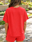 Sunlit Garden Path in Red Knit Outfit.png