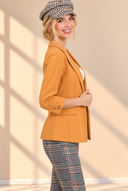 Warm Editorial Portrait in Mustard Blazer.png