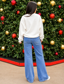 Woman Before a Festive Christmas Tree.png